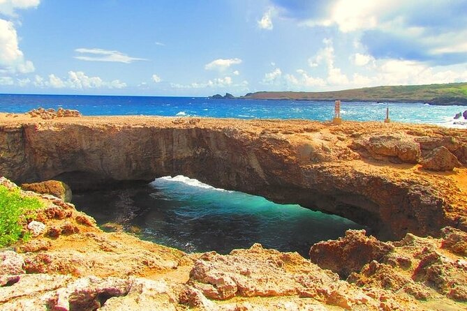 Aruba Cave Pool and Secret Beach Safari Tour - Cave Pool Aruba: cliff-jumping vibes, but check access