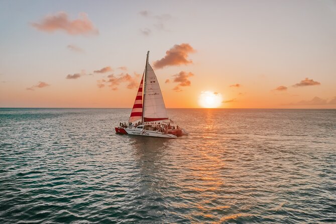 Aruba Sunset Sail Dinner Cruise with Open Bar by Catamaran - The onboard vibe: crew energy, music, and photo moments