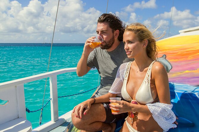 Private Catamaran Adventure Cruise with Rope Swing and Water Slide - Private catamaran adventure in Aruba: what you’re really paying for
