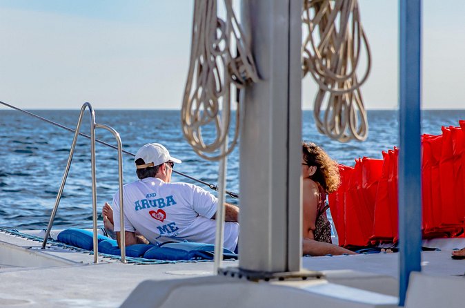 Private Sunset Catamaran Adventure Cruise with Open Bar - Arashi Beach and the coastline views you’ll want to slow down for